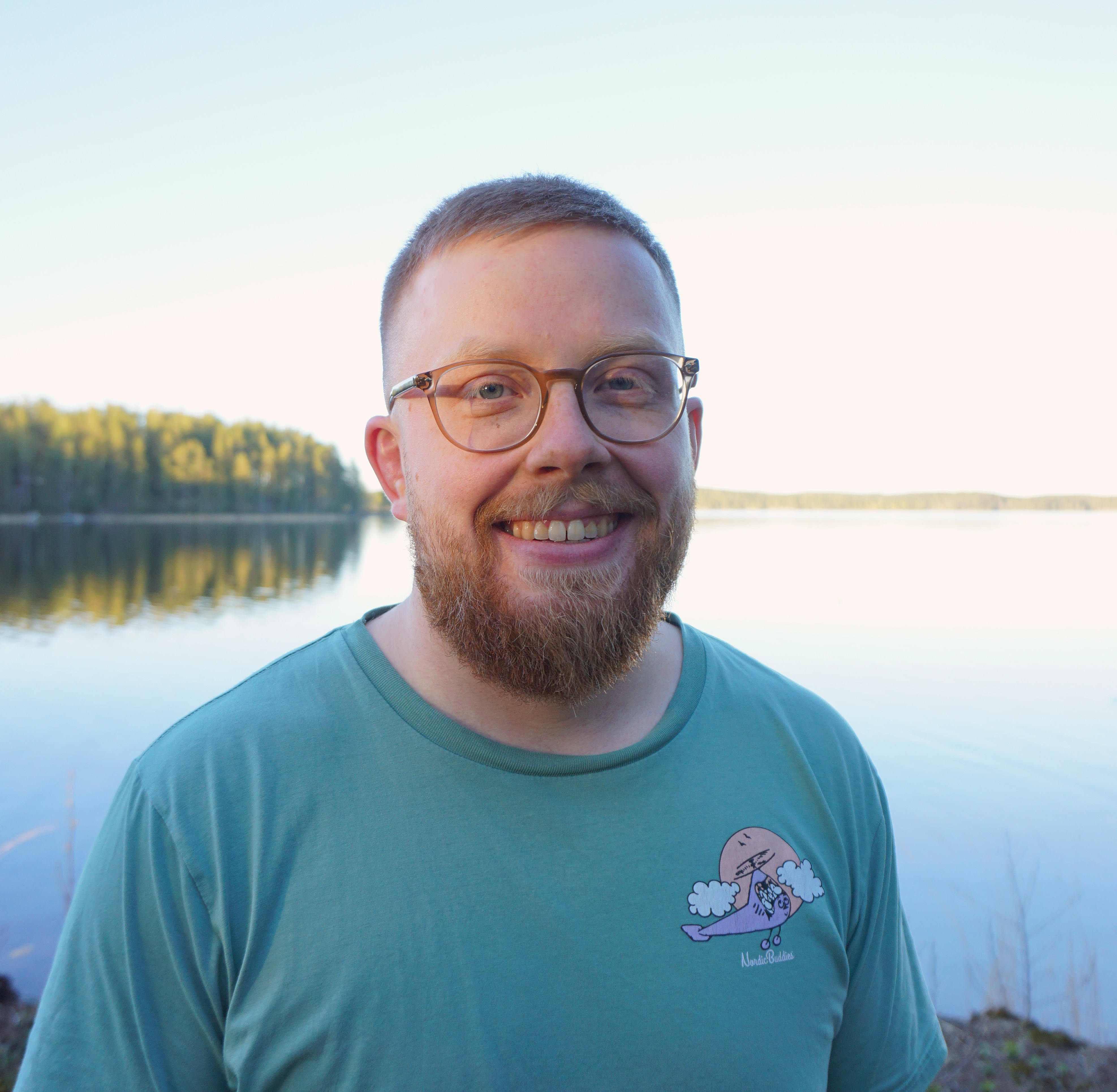 Reijo Jaakkola standing by a lake in Finland